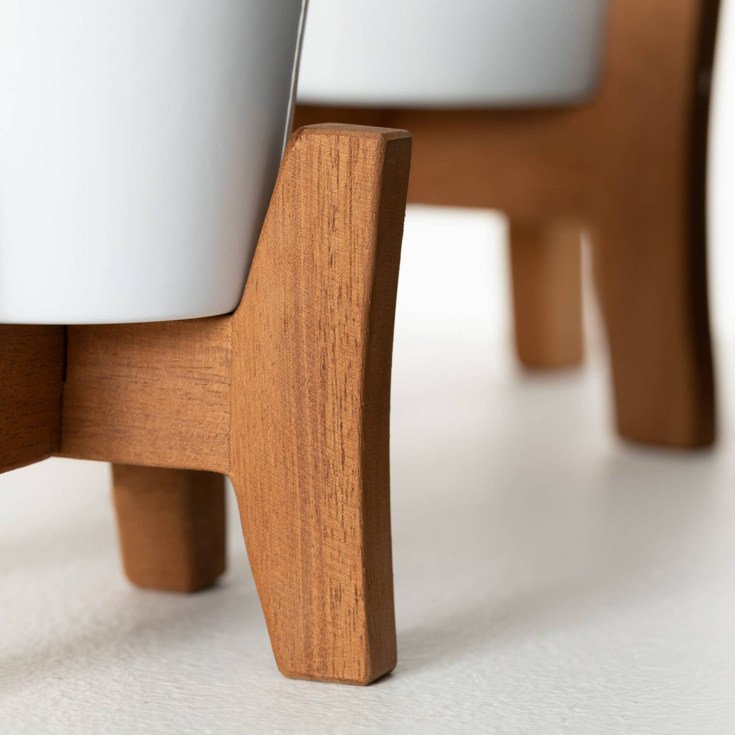 White Ceramic Planters On Wood